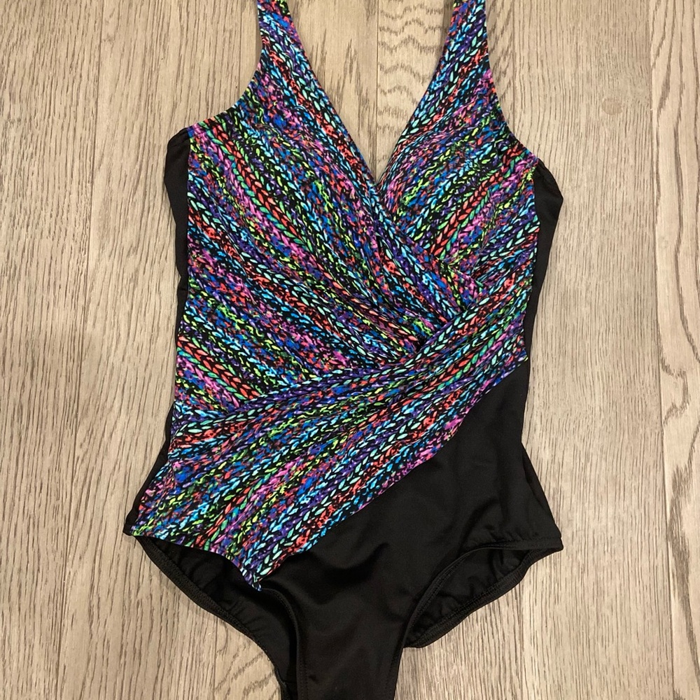 Miracle one piece woman’s bathing suit. New with tags
